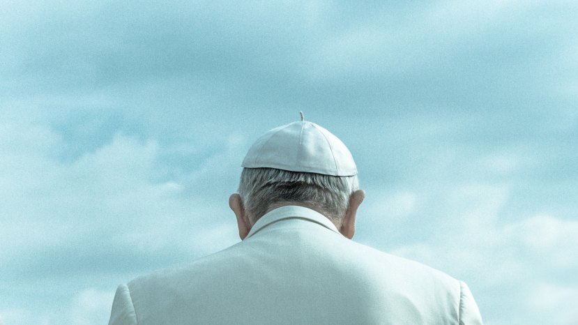 Priest wearing white hat